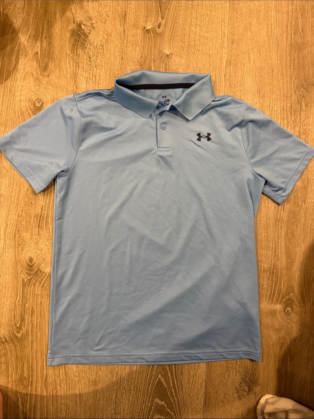 Under Armour Boys size Youth LargeCarolina Blue Performance Polo with Black Logo